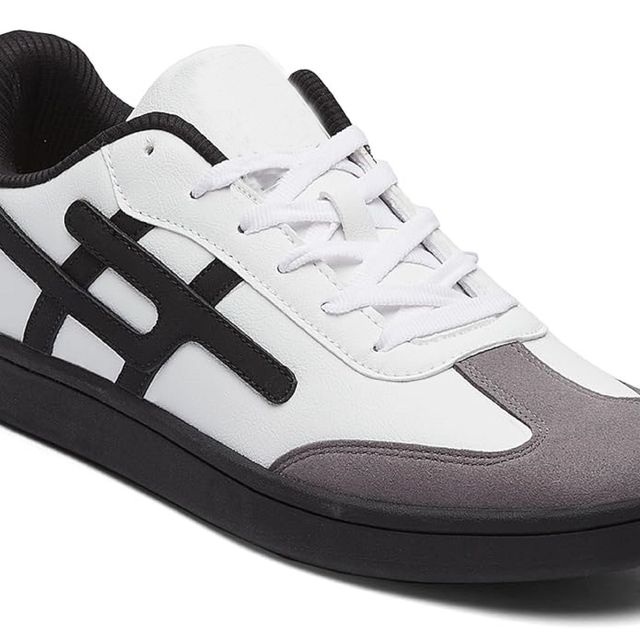 White and black sneaker with gray sole on a white background
