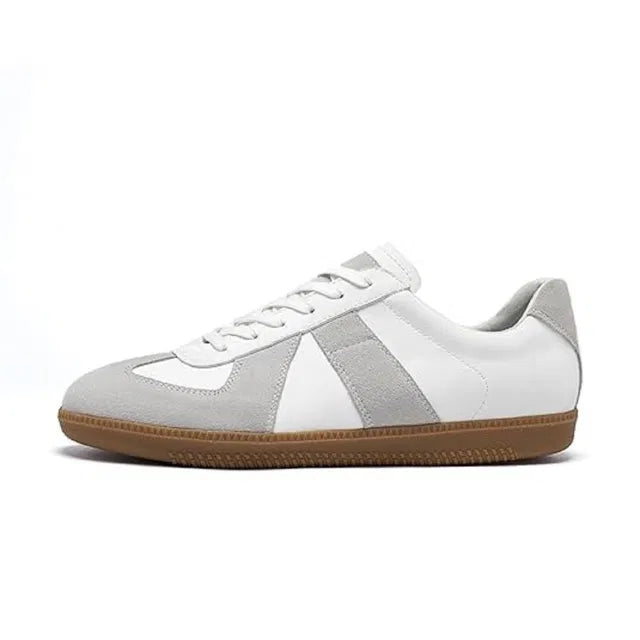 White and gray sneaker with a brown sole on a white background