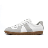 White and gray sneaker with a brown sole on a white background