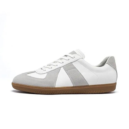 White and gray sneaker with a brown sole on a white background