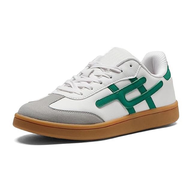White and gray sneaker with green accents on a white background