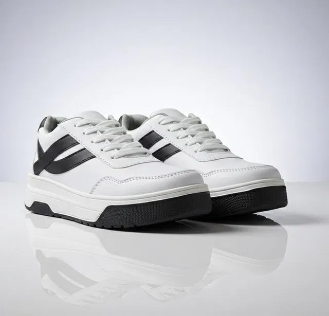 White sneakers with black accents on a reflective surface