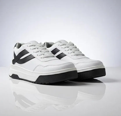 White sneakers with black accents on a reflective surface