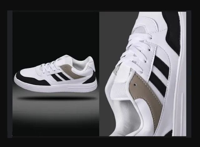 White sneakers with black stripes on a dark background